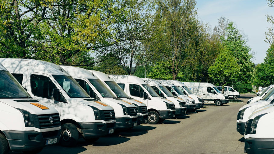 Rows of commercial vans ready for fleet graphics planning and production