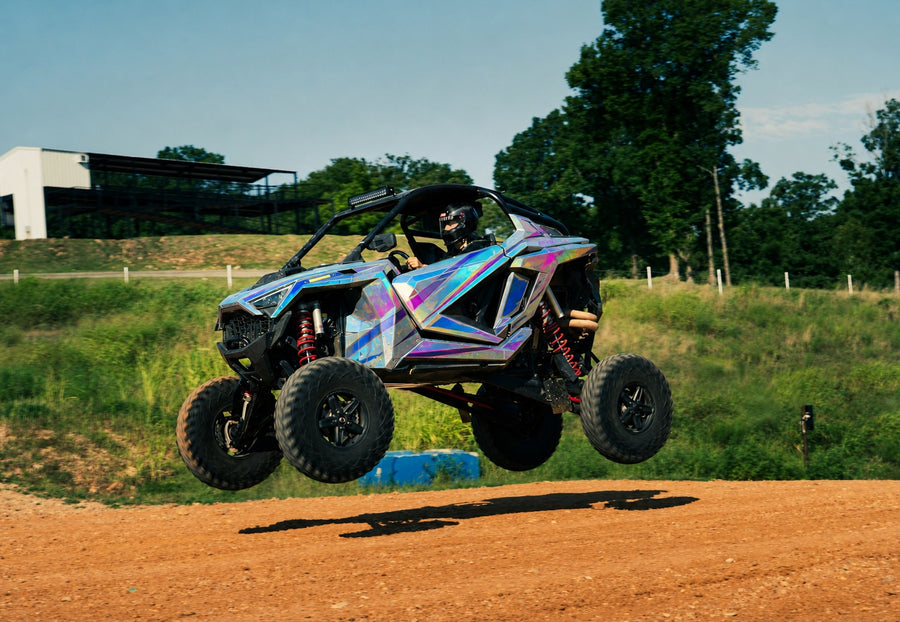 Jumping UTV with cyan magenta and silver holographic printable vinyl graphics