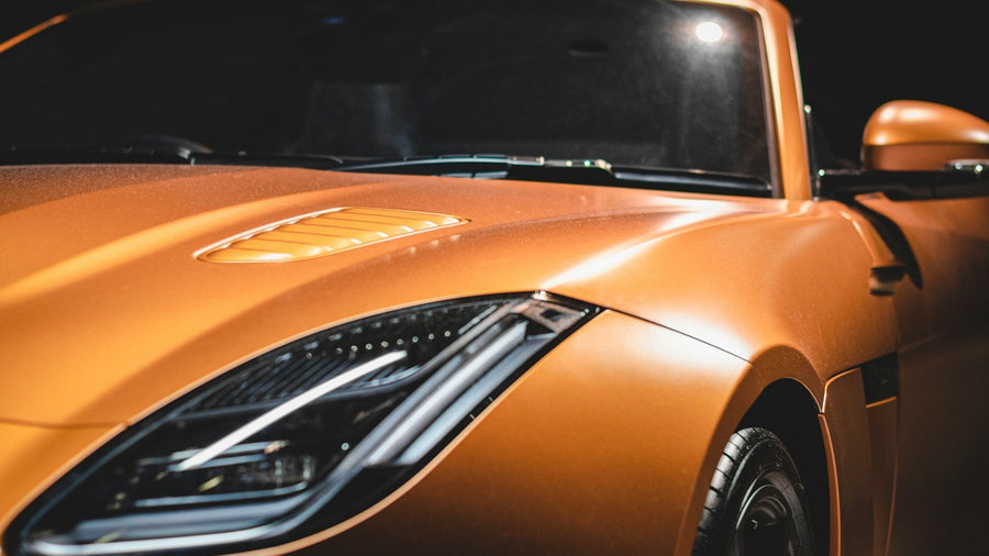 Close view of complex curves and panel transitions on a sports car body